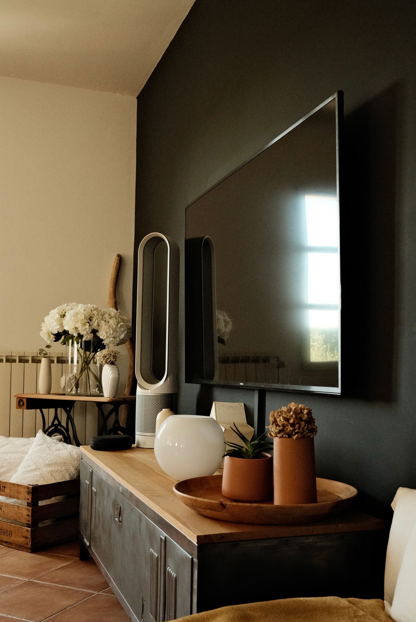 Living room with a wall-mounted TV installed by TVCare Mumbai